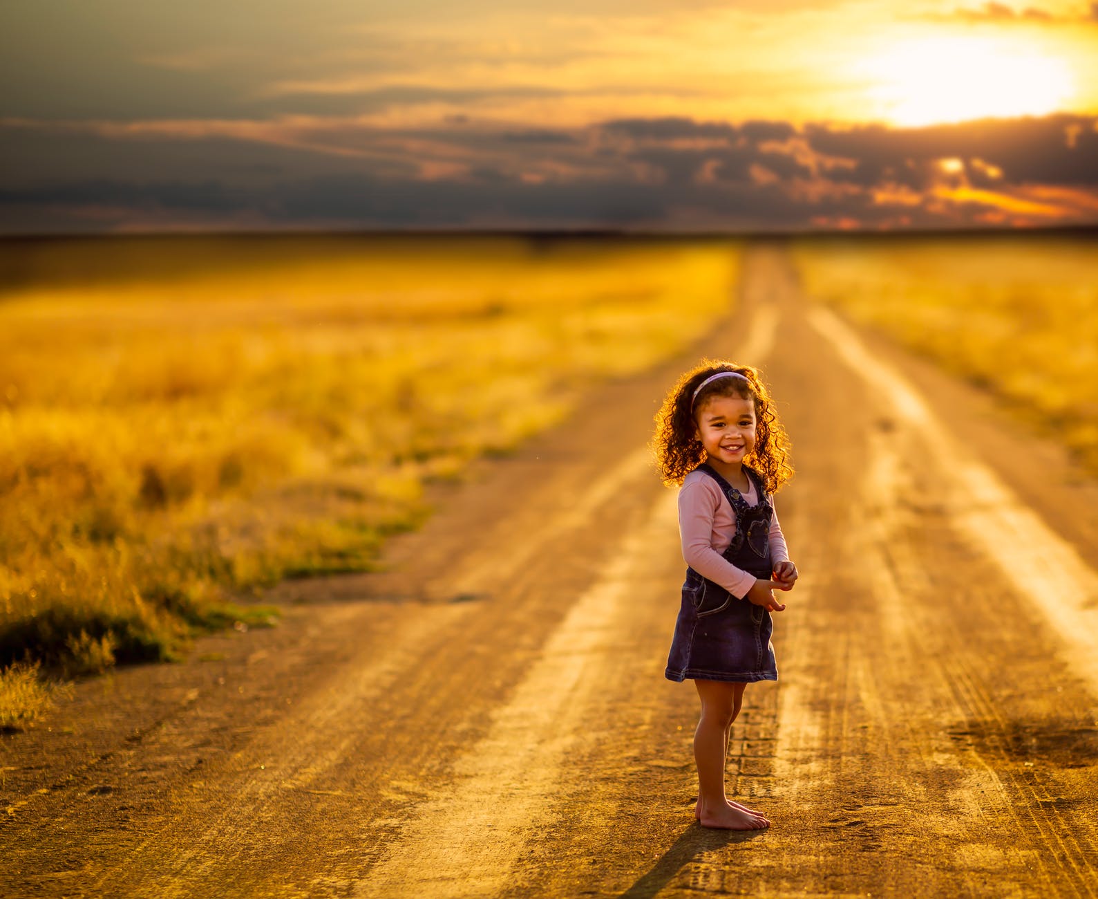 girl standing in the middle of the road